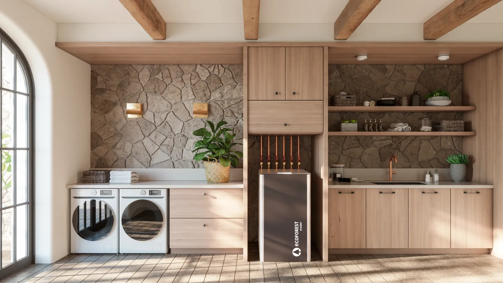 A utility room with arched windows, stone walls and light oak cabinets, with an ecoGEO+ unit standing between the laundry and the sink, with six copper pipes rising from it